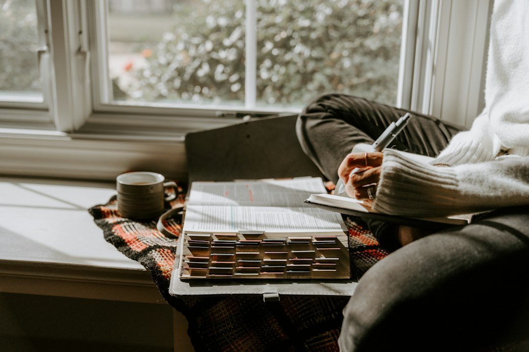 Writer working on an early story draft in a notebook, illustrating Paper Bark's support for new screenwriters
